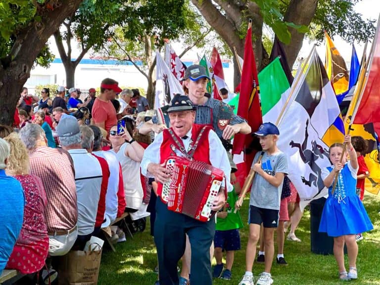 Arthur Brogli Flag parade with a crowd