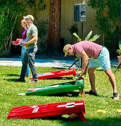 People playing cornhole