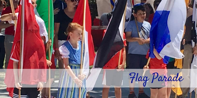 Image os two children holding Swiss Flags