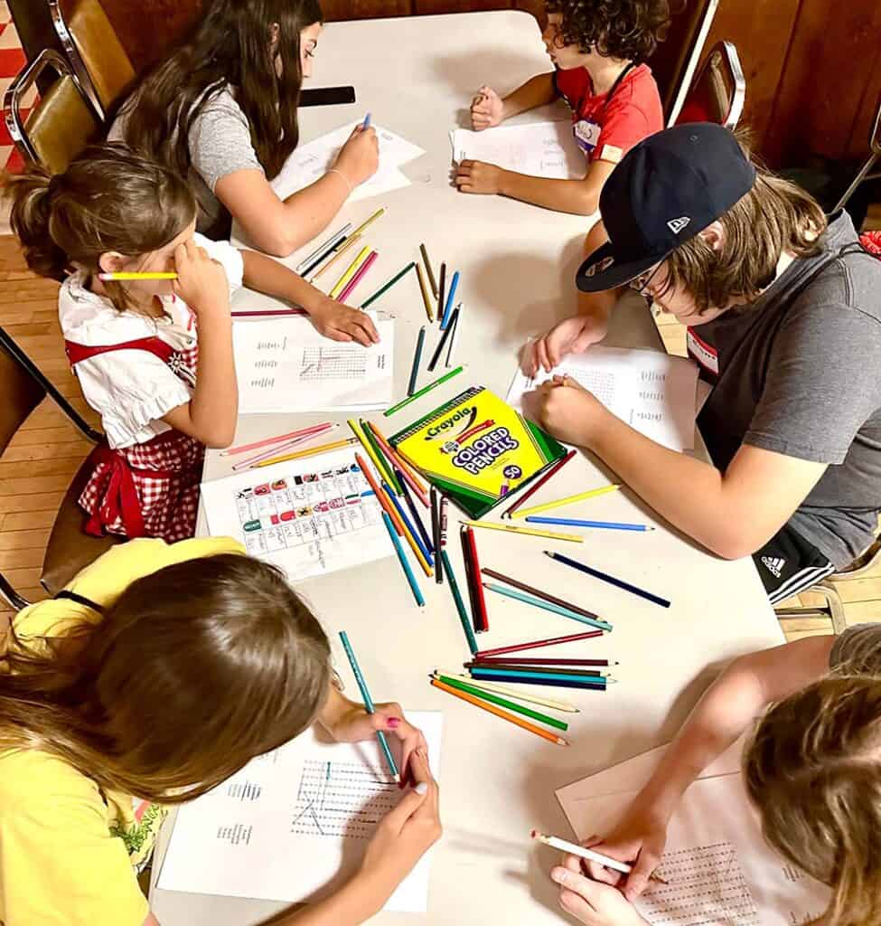 Kids at a table working on a project